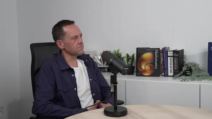 The reverse camera angle showing the other speaker in the same conversation